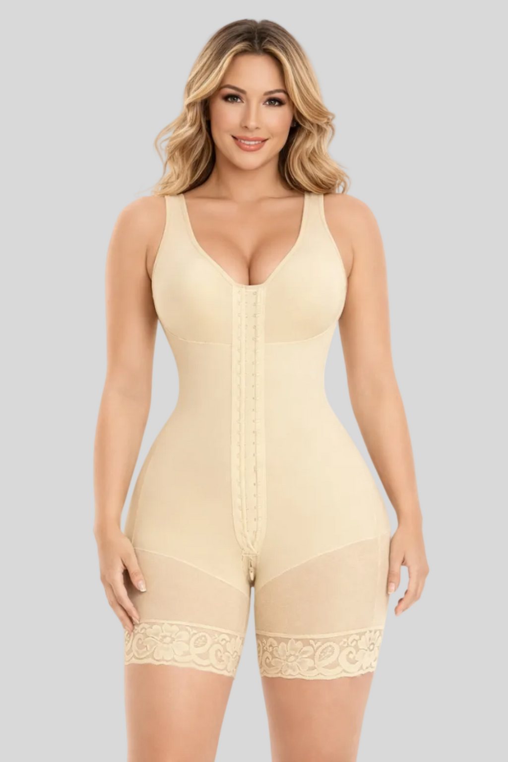 Woman wearing a beige shapewear romper on a white background