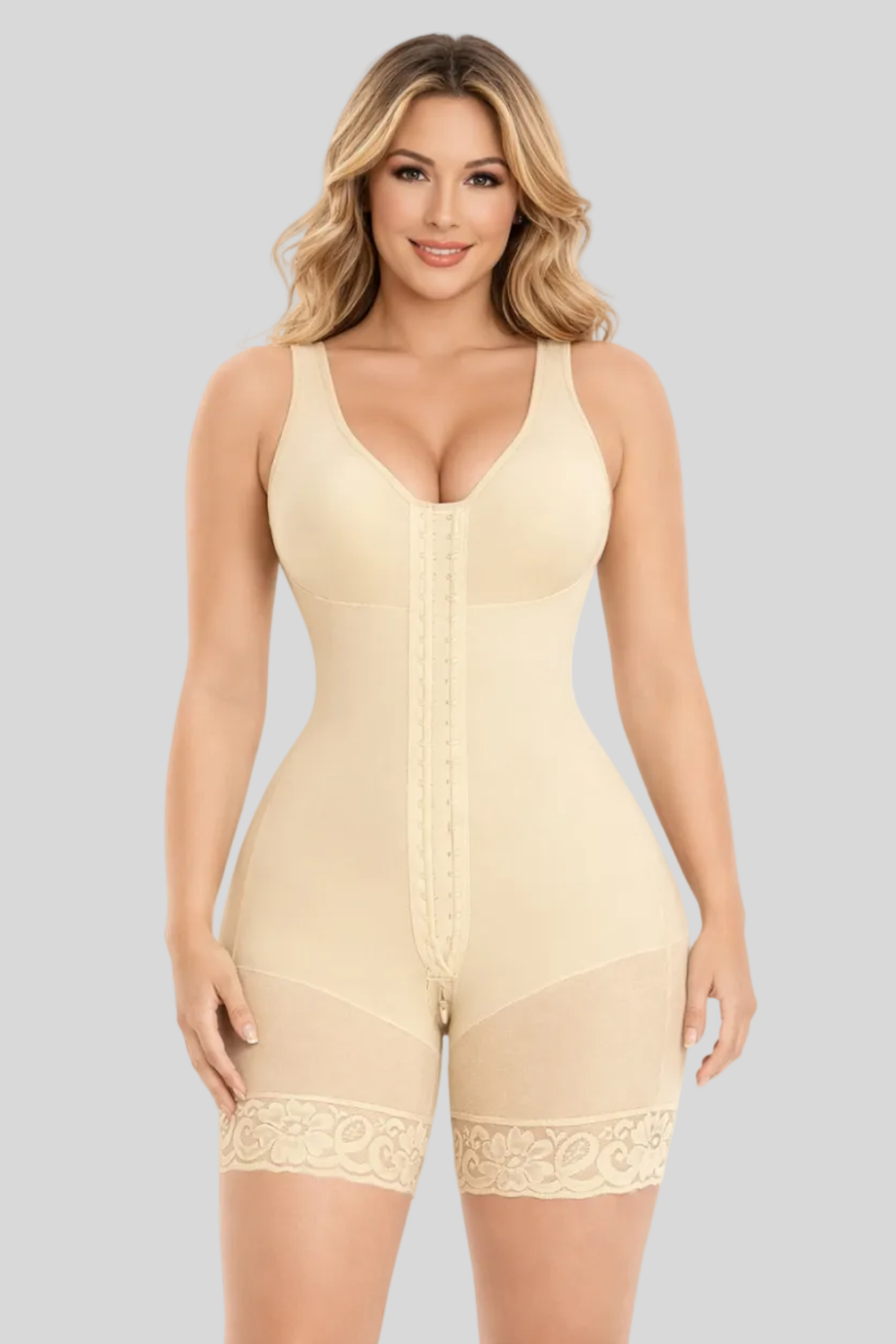 Woman wearing a beige shapewear romper on a white background