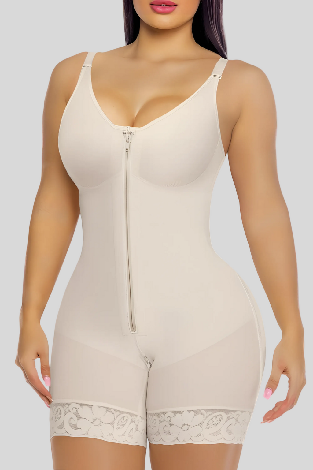 Beige shapewear bodysuit worn by a model on a white background