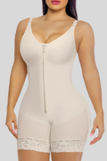 Beige shapewear bodysuit worn by a model on a white background
