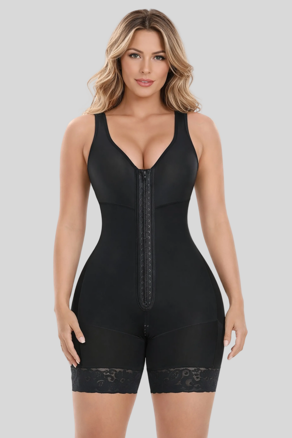 Woman wearing a black shapewear bodysuit on a white background