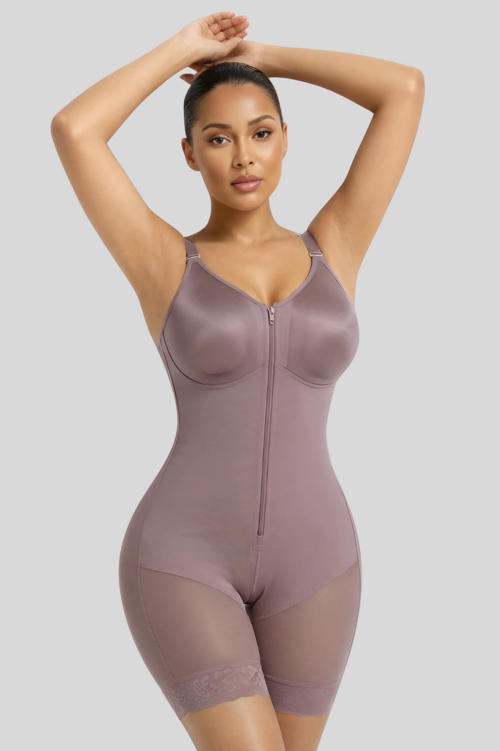 Woman wearing a beige shapewear bodysuit on a white background